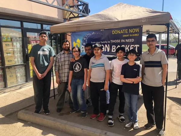Family receiving Ramadan basket